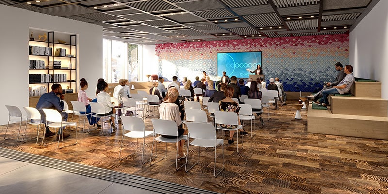 Lecture room with mounted TV on a colorful accent wall 